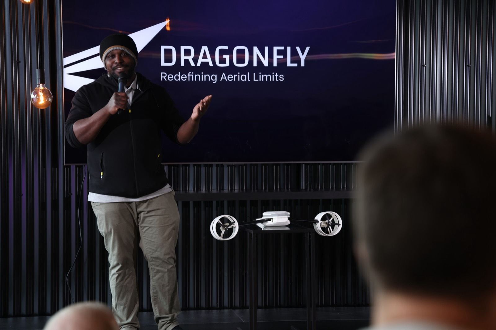 Founder presenting the Dragonfly drone at Frontier Machines